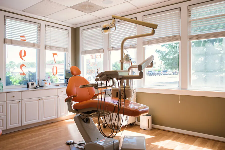 A treatment chair in a sunlit room at the practice